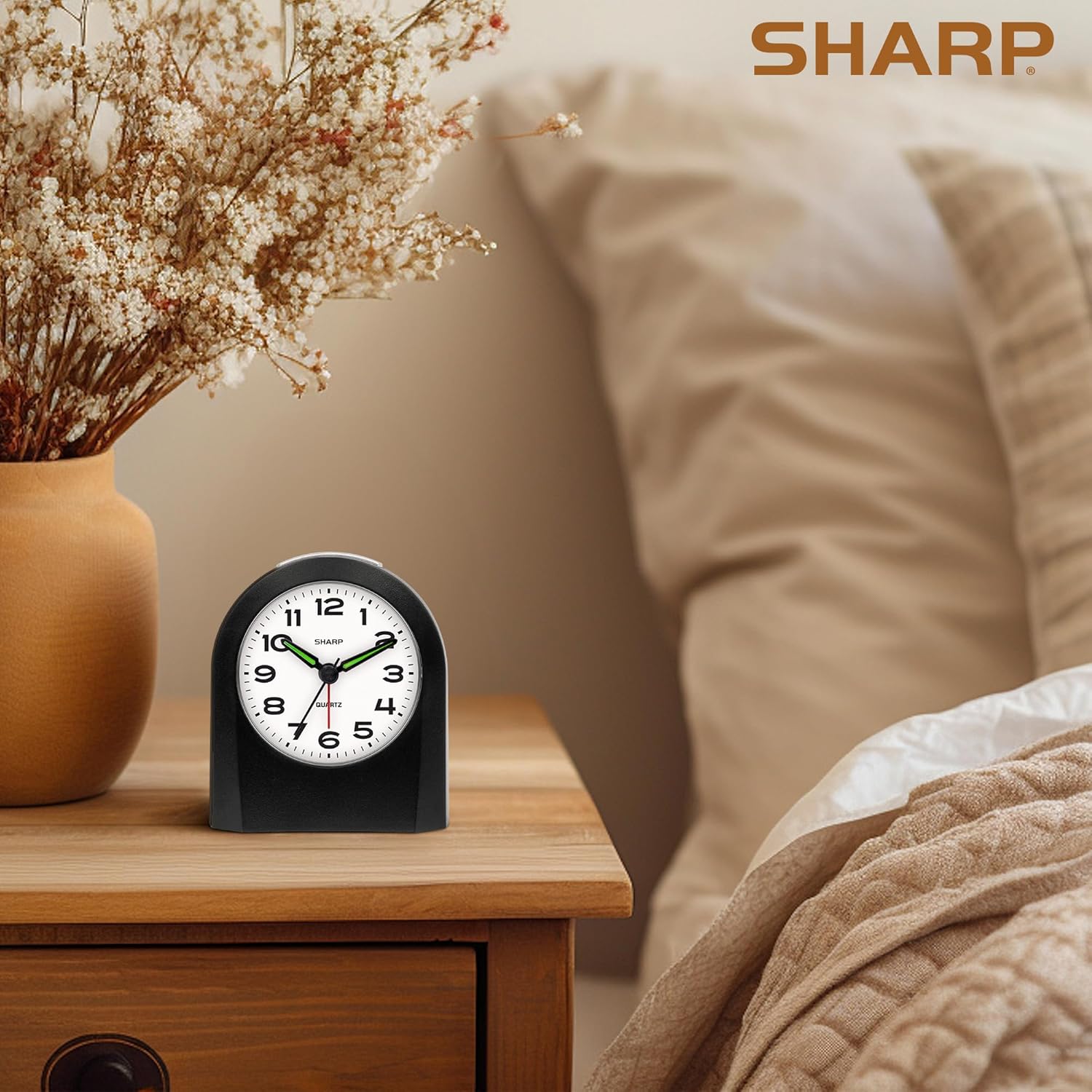 Sharp Battery-Powered Analog Alarm Clock, Silent Sweep, Snooze and Light | Silent no-tick movement; Ascending beep alarm; Gentle wake; Snooze; On-demand light; Compact size; Battery operated; Black